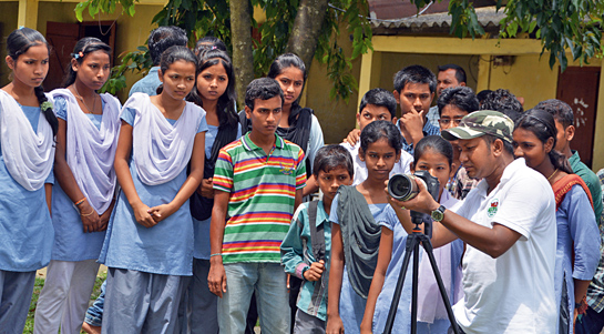 Biswajit De, Founder President of WildRoots, imparts photography skills to students.
